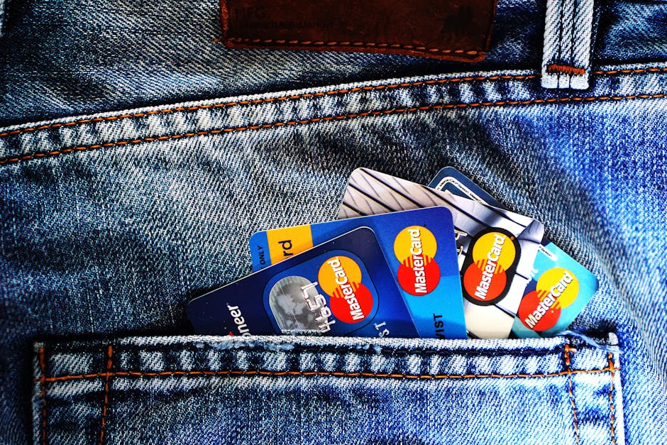 pexels-photo-164571-164571 Close-up of a denim pocket with multiple credit cards, illustrating finance and fashion.
