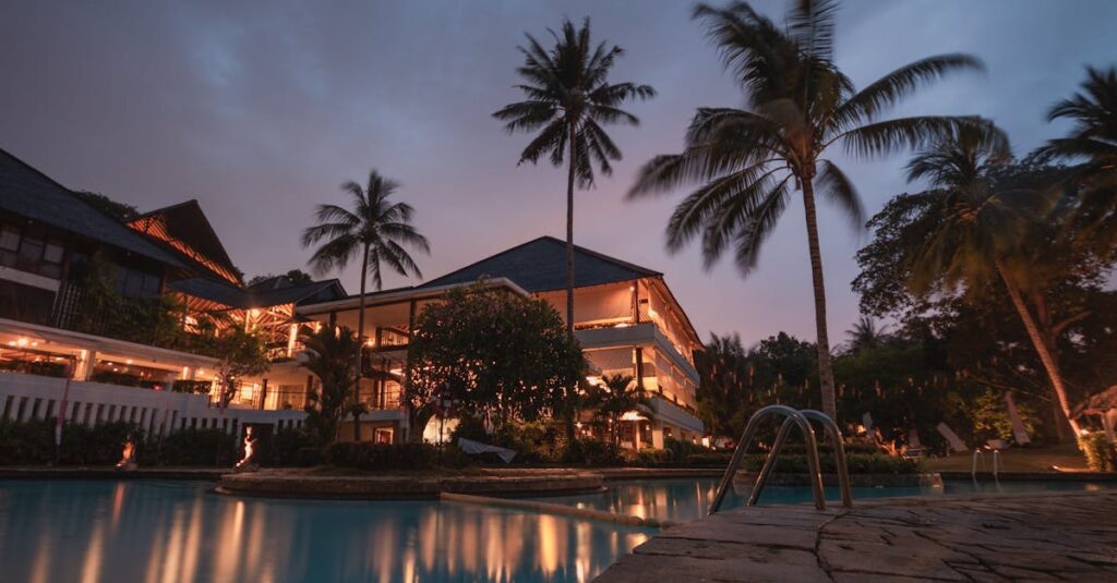 pexels-photo-258154-258154 Luxurious tropical resort with swimming pool and palms at dusk, perfect for a tranquil vacation.