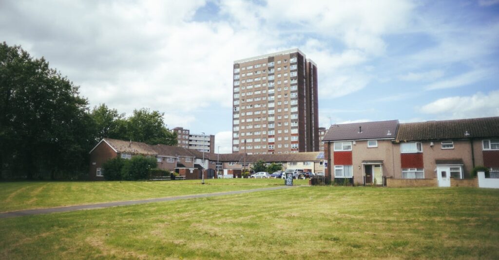 pexels-photo-28199965-28199965 Urban residential area with tower block in Leeds, sunny day.